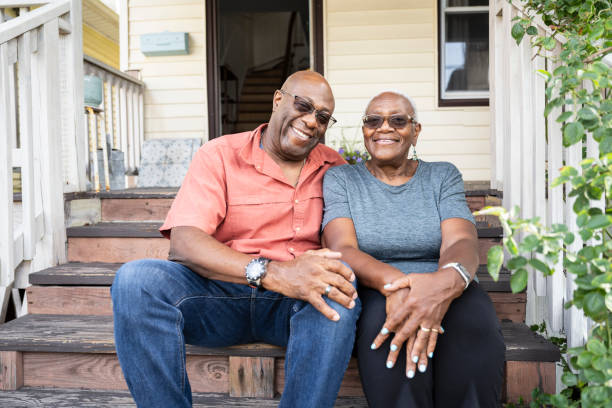 istock Portrait of cheerful Black seniors on front steps 1736960132