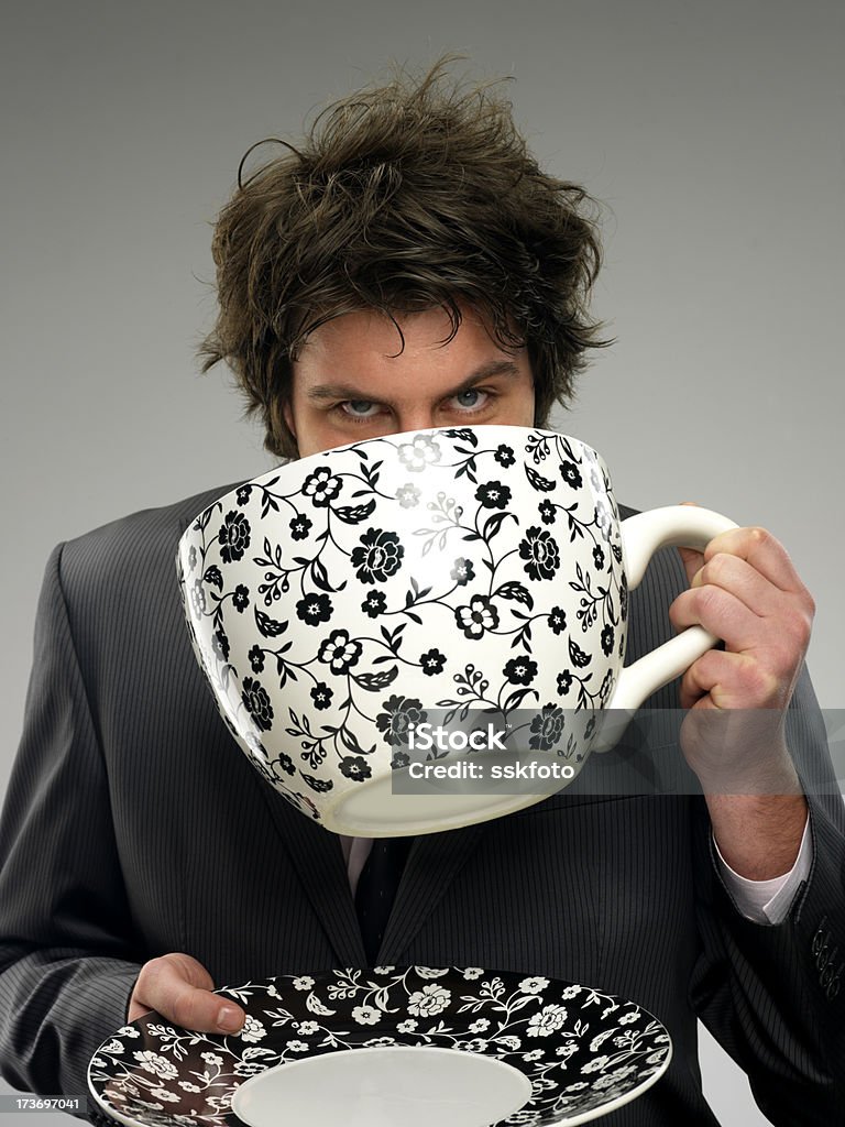 big cup Businessman drinking coffee. 20-24 Years Stock Photo