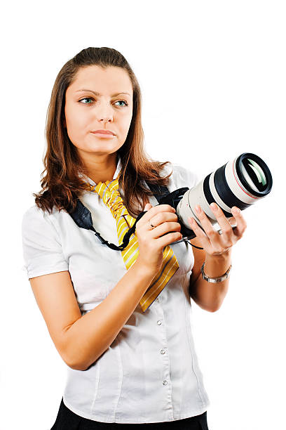 istock Young woman holding SLR camera 173697125