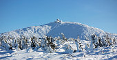 The snow-capped peak of the Snezka Mountain in the Krkonose Mountains