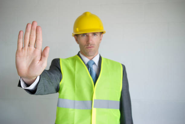 istock Hard Hat Hand Out 173697626