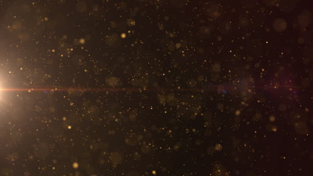 Gold defocus bokeh particle horizontal flowing from left to right scene concept. Debris floating  loop 4K motion background.