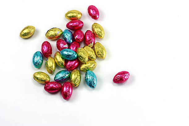 istock Chocolate Easter Egg candy with Colorful Foil isolated on white 173698703