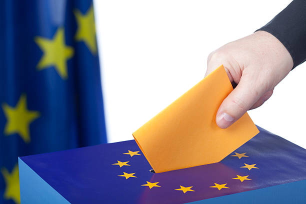 istock Male hand inserting ballot to EU ballot box 173698764
