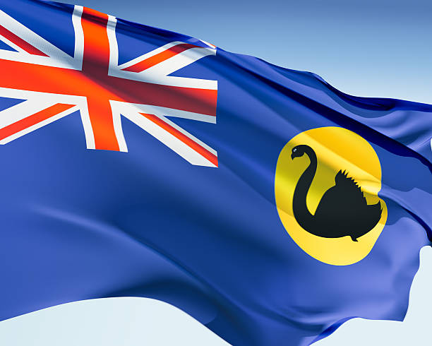 Flag of Western Australia Western Australian flag waving in the wind. Elaborate rendering including motion blur and even a fabric texture (visible at 100%). western australia flag stock pictures, royalty-free photos & images