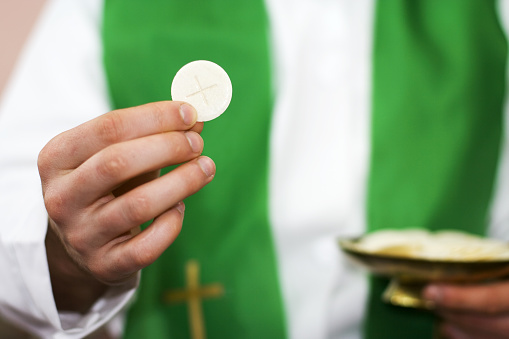 Priest of communion in the hand