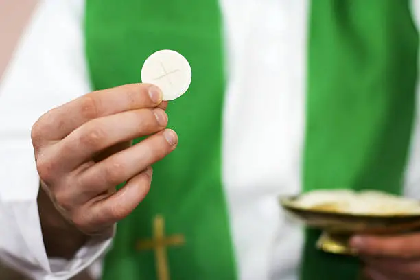 Photo of Priest of communion in the hand