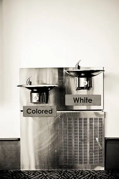 Photo of Marked drinking fountains depicting separation and racism
