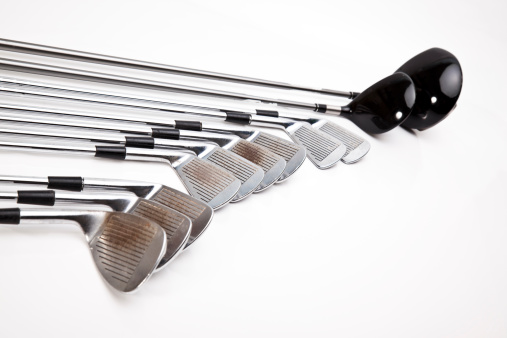complete golf club set on white...
