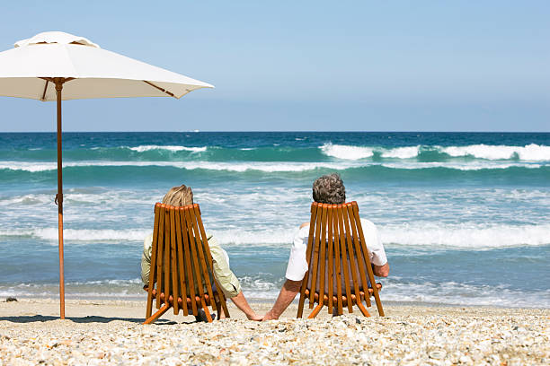 istock couple holding hands in the beach 173701273