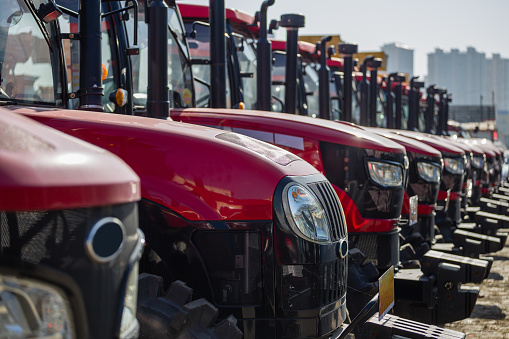 Red tractors in a row