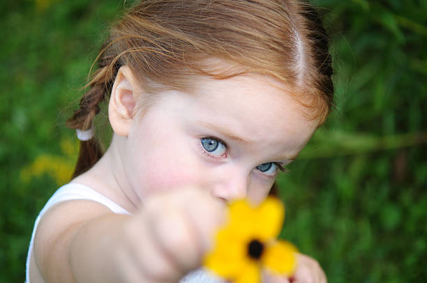 Primary age girl pointing at cameraFor more pictures from this series please see