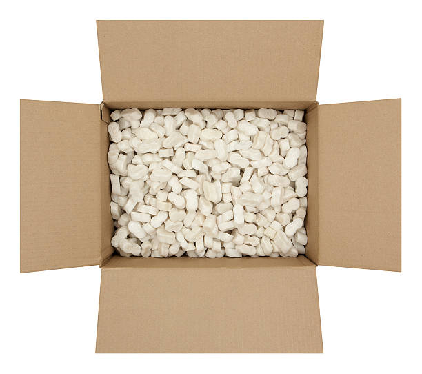 Cardboard Box with Shipping Peanuts Open cardboard box filled with styrofoam shipping peanuts. Isolated on white background.Please also see my lightbox: polystyrene box stock pictures, royalty-free photos & images