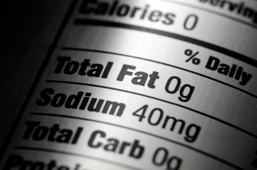 Macro of a nutrition ingredients label on a silver aluminum diet pop can.