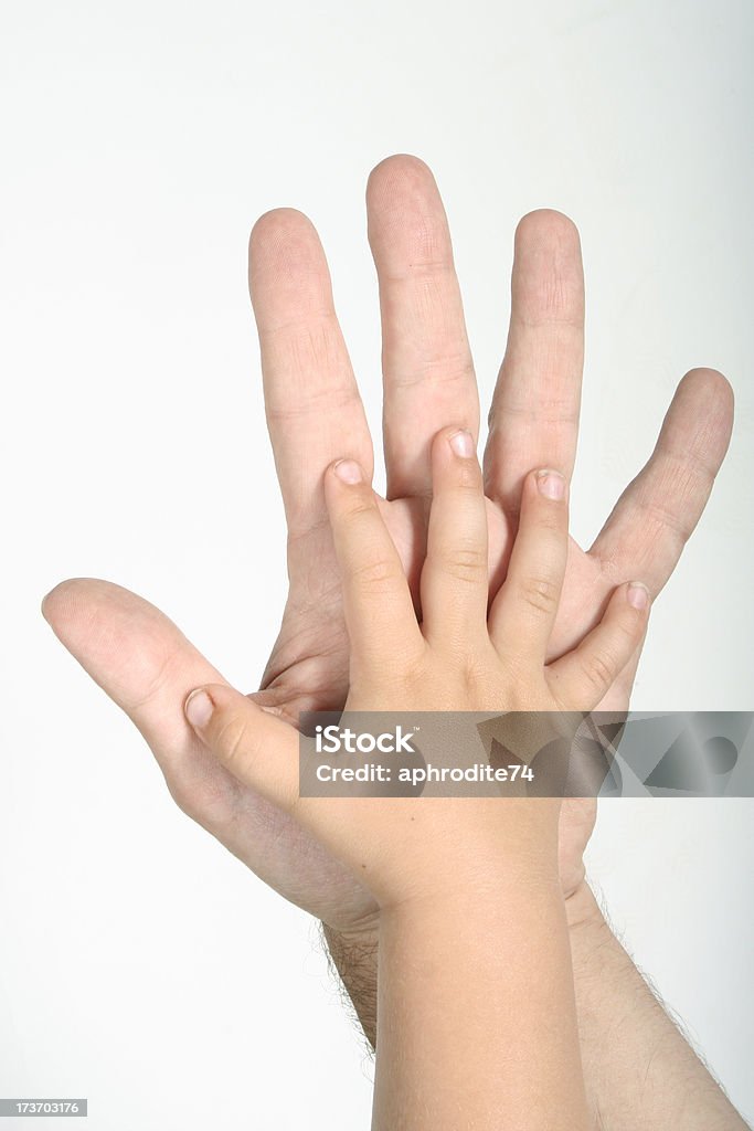 Big And Small Hands Stock Photo - Download Image Now - Adult