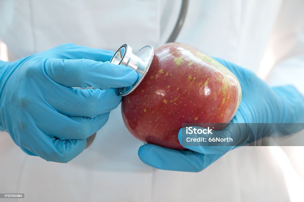 Food Health Apple Healthfood Diet Fruit A scientist or a doctor holding a Stethoscope to an Apple.  Concept shot about food safety and health.Please see some similar pictures from my portfolio: Apple - Fruit Stock Photo