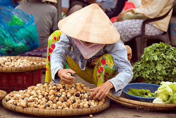 vietnam street market lady seller ho chi minh saigon vietnamese woman market vendor ho chi minh city stock pictures, royalty-free photos & images