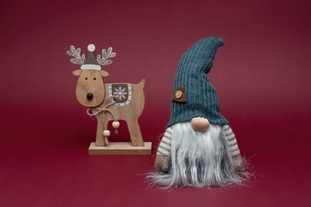 istock Elf in grey hat with reindeer. Christmas style. 1737044650