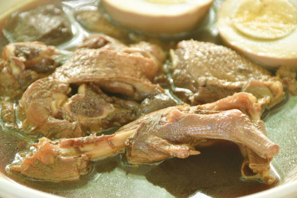 istock boiled half cut egg with braised duck meat and foot in Chinese herb brown soup 1737059636