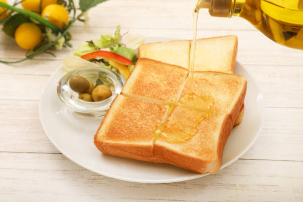istock Scene of olive oil on bread 1737060720