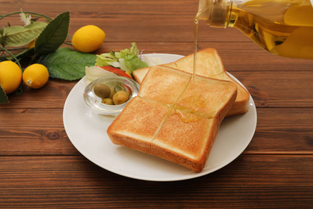 istock Scene of olive oil on bread 1737060724