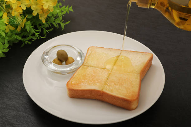 istock Scene of olive oil on bread 1737060727