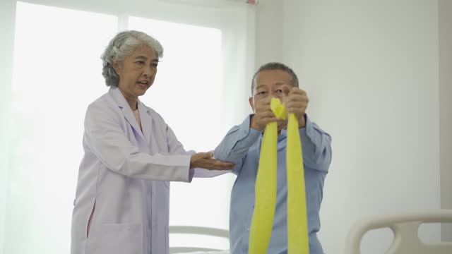 Senior man with physical therapist senior woman exercising Do physical activities and recover from injuries with the help of a physical therapist.