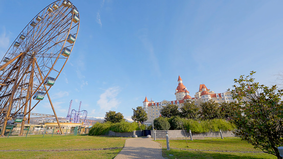 Entertainment park. Action. A huge amusement park filmed in the summer. Ferris wheel. High quality 4k footage