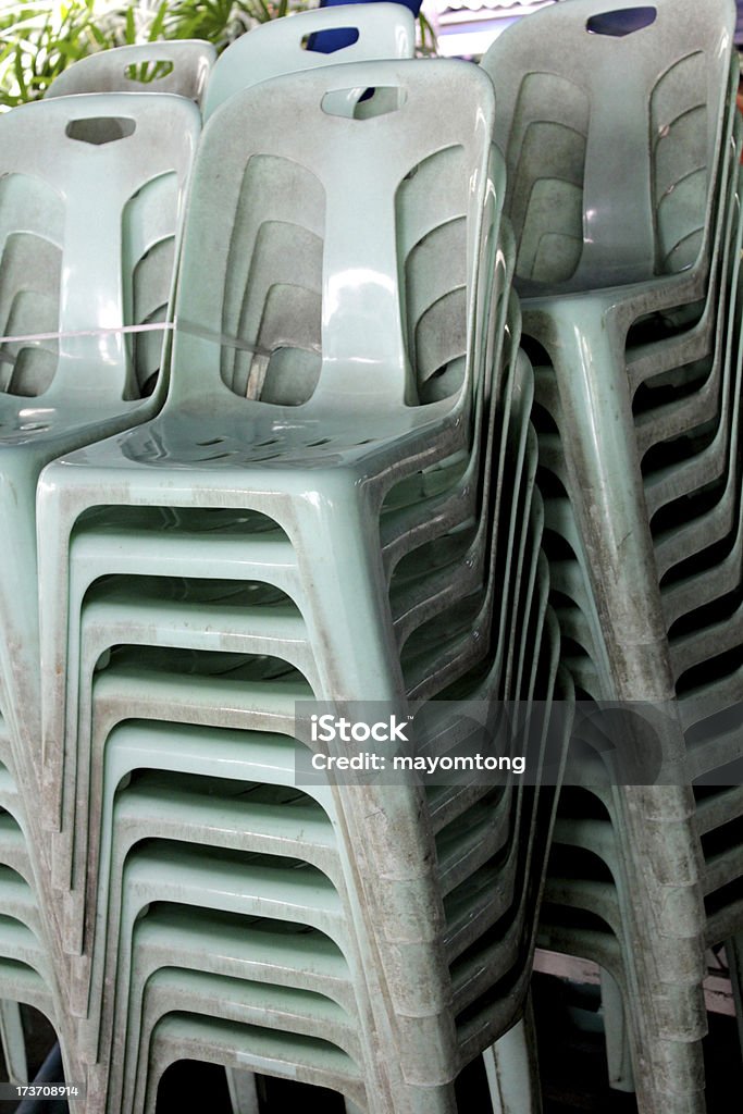 chair Plastic Stacks of chair outdoor in park. Armchair Stock Photo