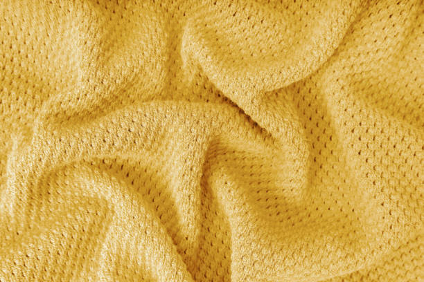 istock Yellow crumpled knitting wool texture background. 1737092860