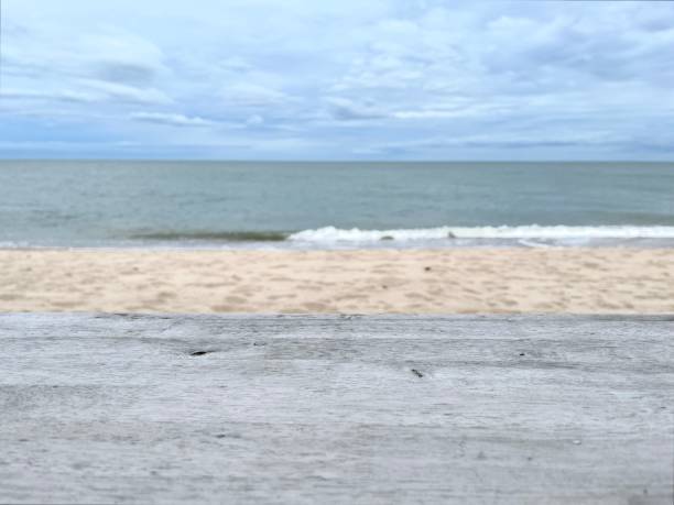 istock Top of wood table at tropical beach 1737093371