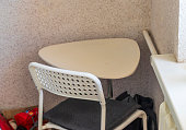 Shot of the small corner table with the chair in the room. Interior