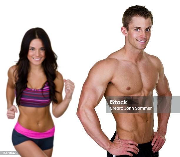 Homem E Mulher Muscular Em - Fotografias de stock e mais imagens de 20-24 Anos - 20-24 Anos, 20-29 Anos, Adulto