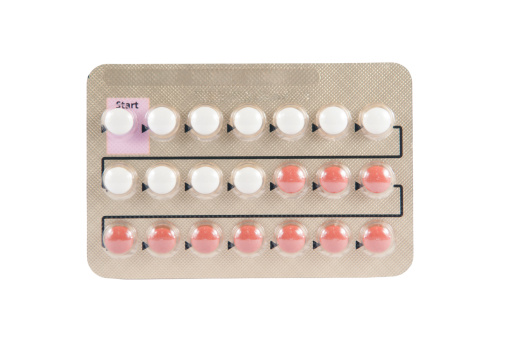 Closed up contraceptive pill in transparent blister pack show direction of use