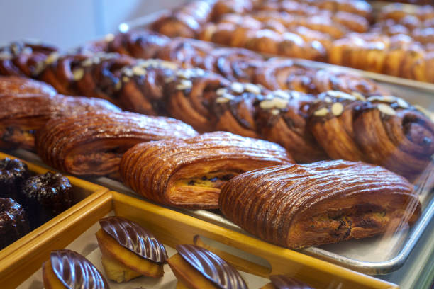 istock Various freshly baked pastries and croissants are displayed in a bakery store 1737112254