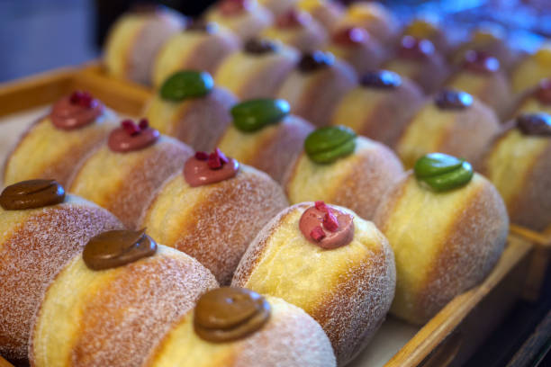 istock Creamy donuts displayed on a tray in a bakery store 1737113373
