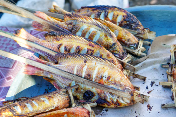 istock Grilled Nile Tilapia, which is a freshwater fish, is grilled using charcoal fire and covered with soy sauce and chili sauce which tastes sweet and spicy. This fish contains a lot of protein. 1737134379
