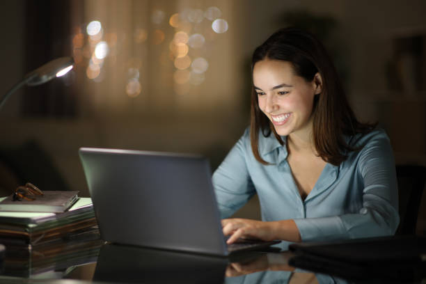 istock Happy tele worker working in the night with laptop 1737143315