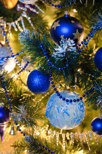 istock Golden and blue baubles on christmas tree for background. New Year concept. 1737173048