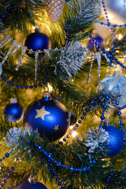istock Golden and blue baubles on christmas tree for background. New Year concept. 1737173087