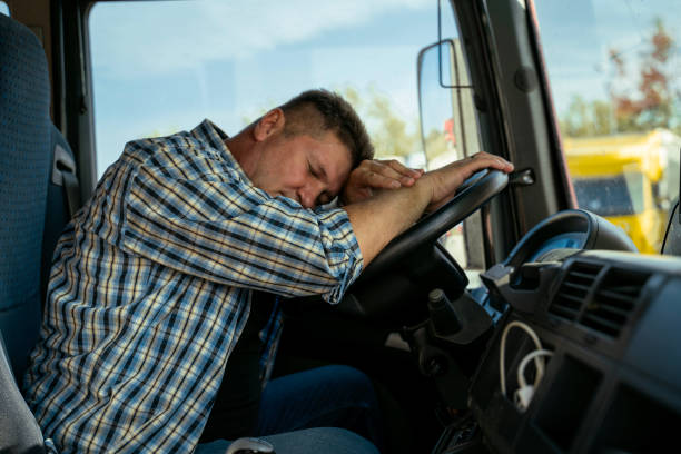 istock Tired, exhausted truck driver sleeping on the wheel, having rest or brake 1737181226