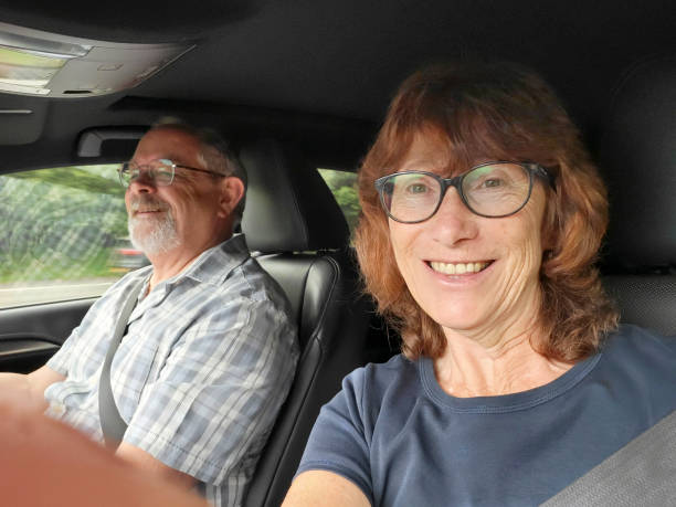 istock Mature couple driving in a car. 1737184063