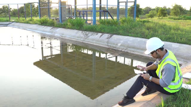 Environmental engineer working at wastewater treatment plant