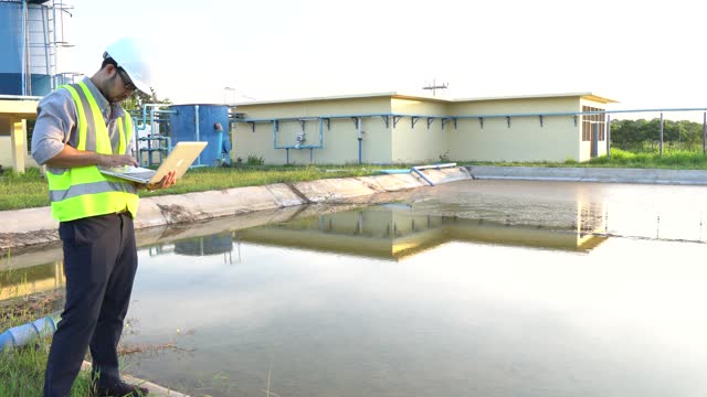 Environmental engineer working at wastewater treatment plant