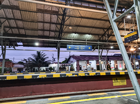 Yogyakarta, Indonesia - 25 September 2023: In the enchanting stillness of dawn, Yogyakarta Station takes on a surreal charm. Bathed in the delicate light of the early morning, the station stands in a hushed slumber, awaiting the day's awakening