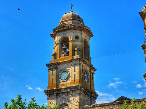detail of the bell tower with clock of the catholic church Parroquia de la Santísima Trinidad in Uruguay