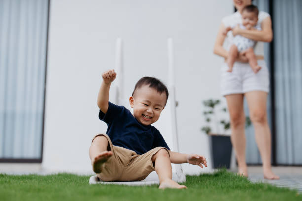 istock Asian chinese boy playing slide in the backyard 1737242361