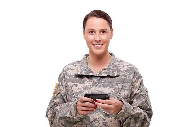 istock Happy female soldier using mobile phone 173724654