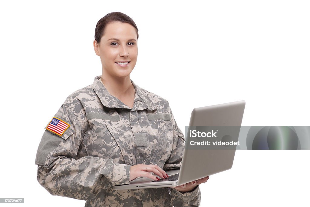 Portrait of a female soldier using laptop Smiling female soldier using a laptop Veteran Stock Photo