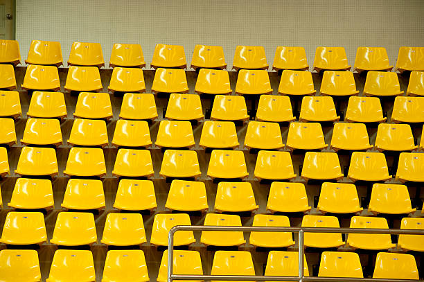 istock Colorful seats texture in basketball stadium . 173724928